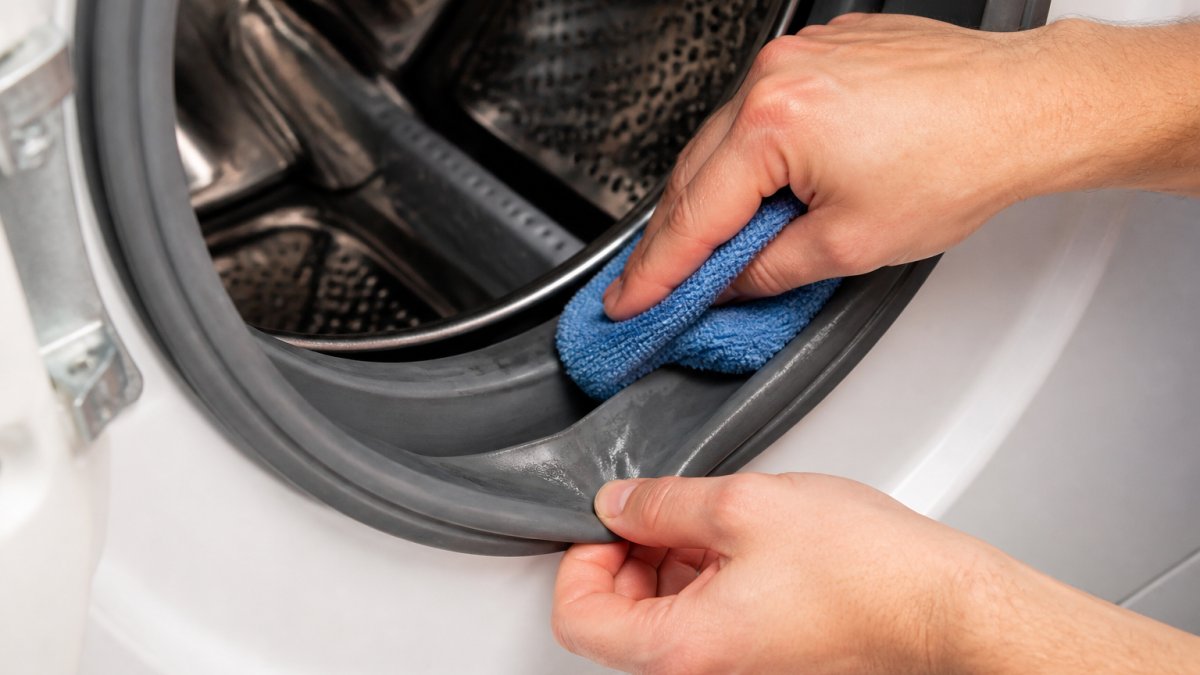 Step-by-step process to clean a washer gasket and remove washer odors by wiping inside the rubber seal folds.